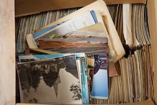 Four boxes of Edwardian and later postcards, some divided into categories including horses, lighthouses, railways, royalty, dogs, aviation, greetings, etc. Condition - fair to good.